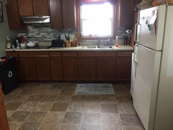 Kitchen with new vinyl flooring and counter. All appliances included.