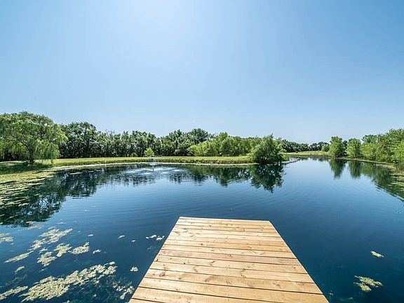 and watch the beautiful Kansas sunsets, listen to the calming sound of the water fountain, or even catch dinner as this pond is stocked with fish!