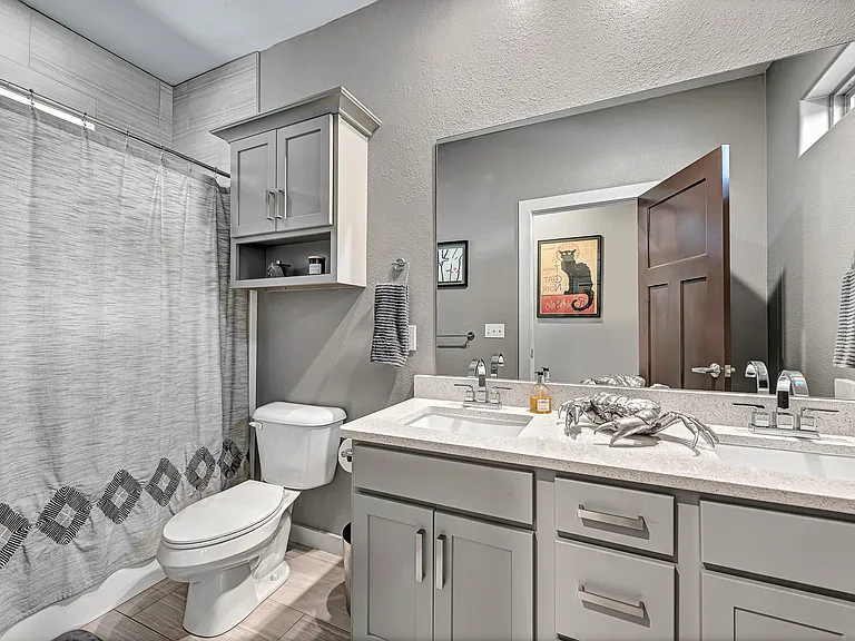 Guest bathroom upstairs with double vanity for the two guest rooms.