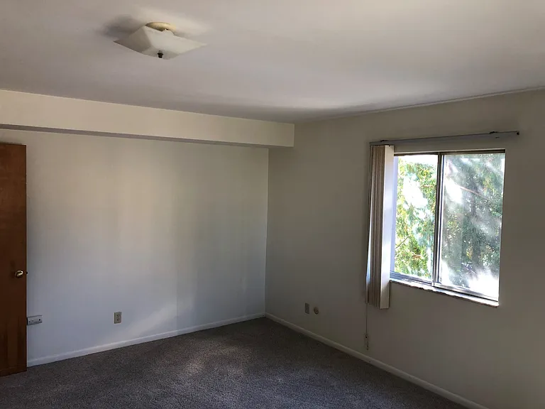 Bedroom 1 entry door and window facing Farragut Street.
