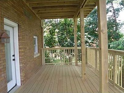 private covered deck overlooking parking
