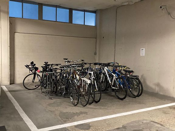 Locked bike storage in garage.