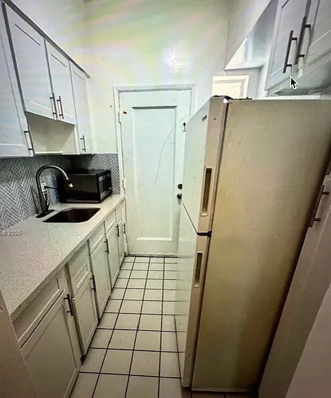 Amazing Kitchen with quartz countertops and tile backsplash