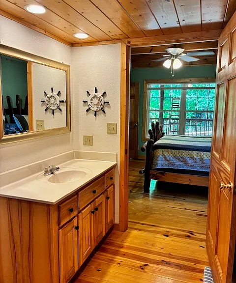 First floor bathroom leading into bedroom