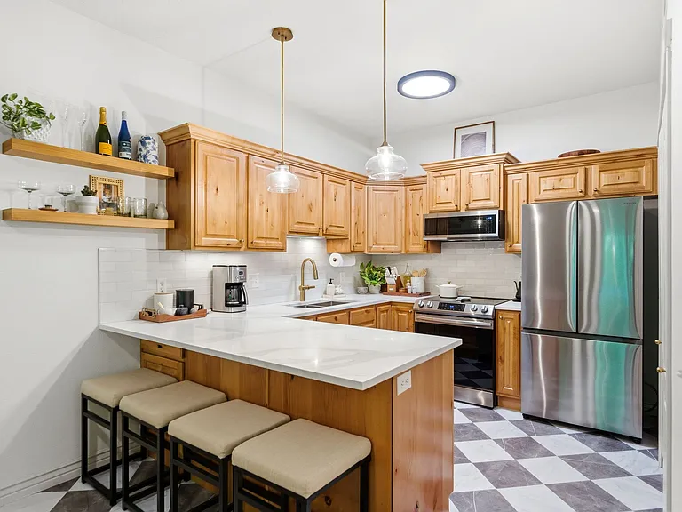 Kitchen with quartz countertops, tile backsplash, new stainless steel appliances