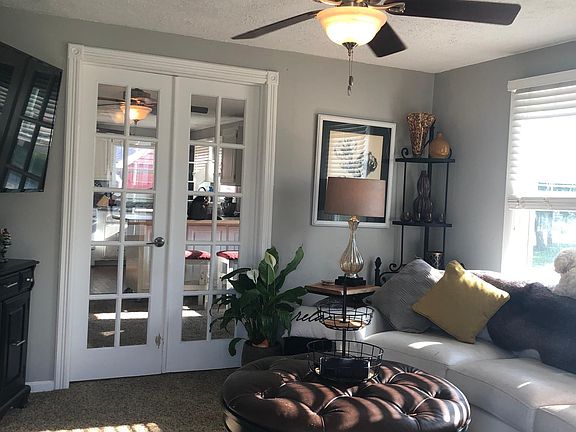 When you walk into the home this is the front room. Comes with mini blinds and ceiling fan freshly painted gray paint throughout the whole house