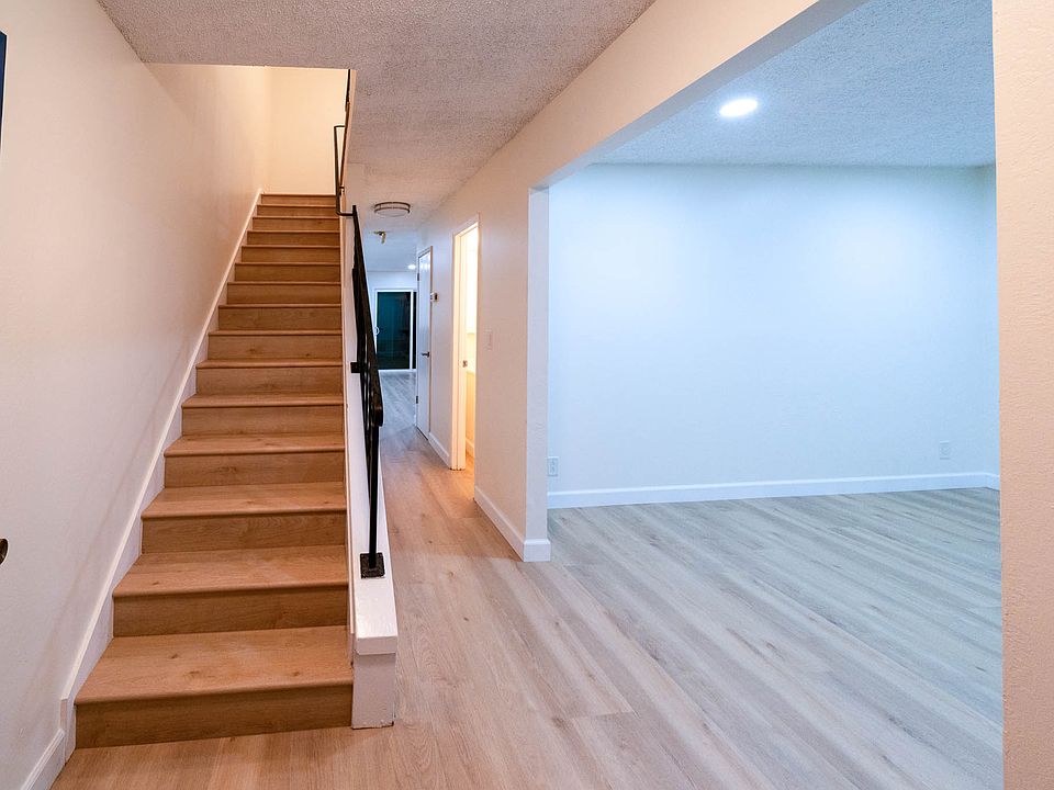 Staircase to 4 bedrooms upstairs