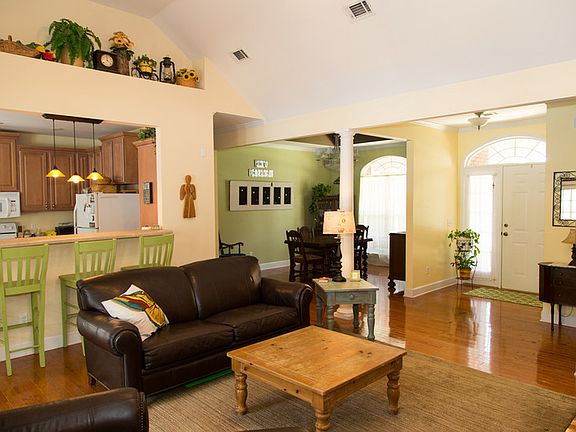 View of kitchen bar, dining room & entry