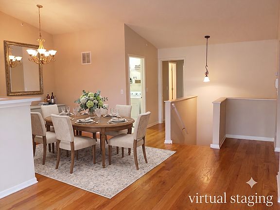 Virtual staging shown. Beautiful open layout dining space.