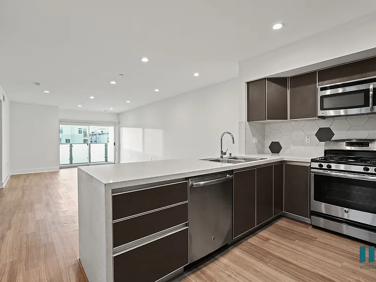 Open-Concept Floor Plan with Recessed Lighting, Vinyl Flooring, and Patio