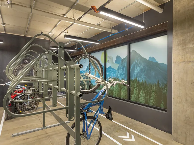 Controlled access bike room with storage racks.