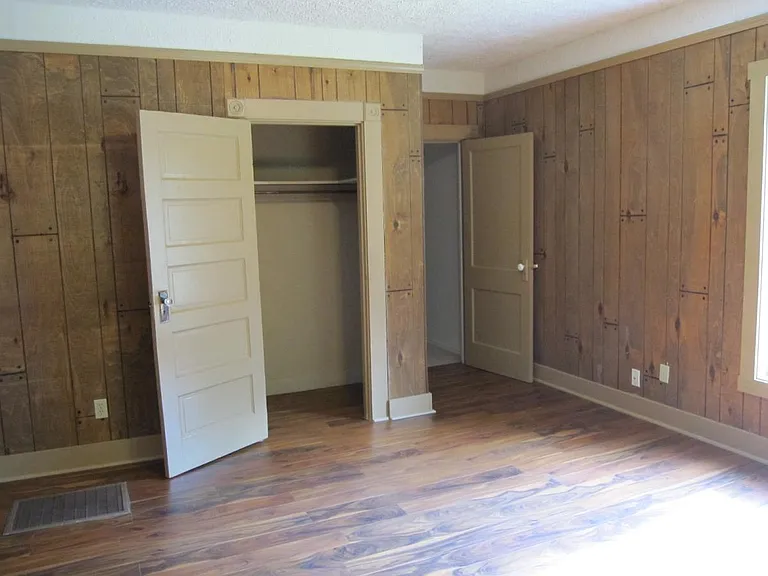 Large bedroom leading to half bath