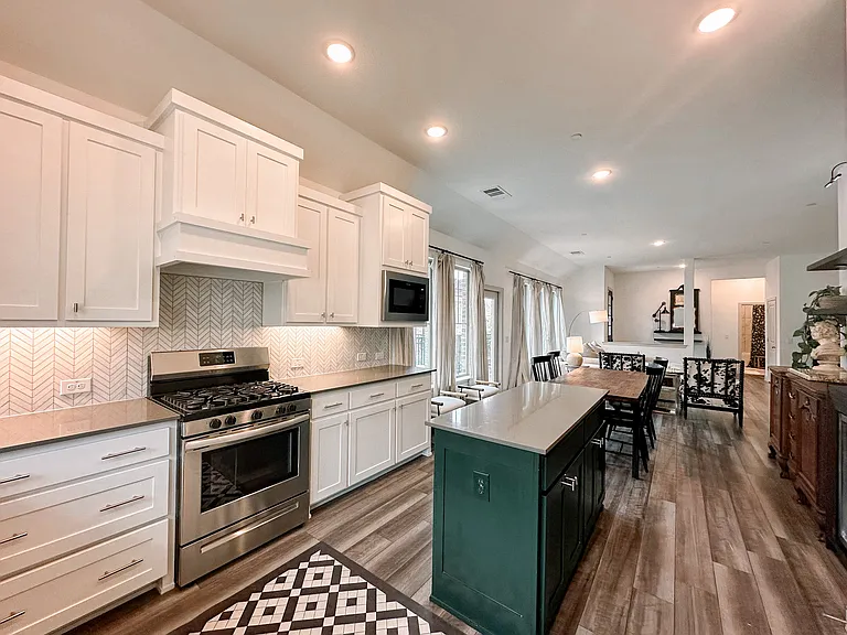 Beautiful kitchen with gas range, island, stainless appliances