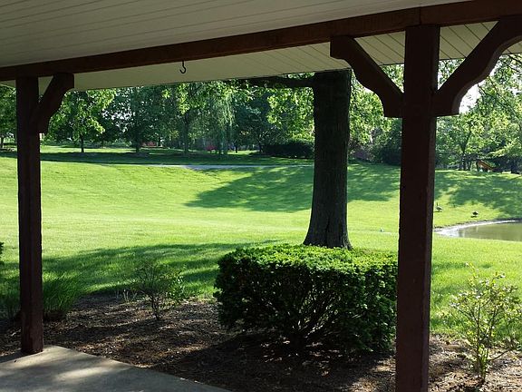 Back yard with overlooks pond and golf course.