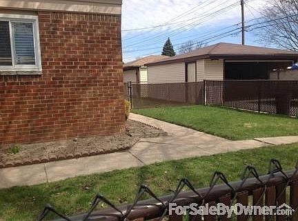 Backyard
						:
						view of side of house and Garage from side street