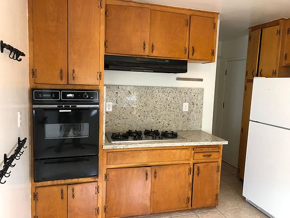 View of Kitchen with new oven, new countertop, and new stovetop
