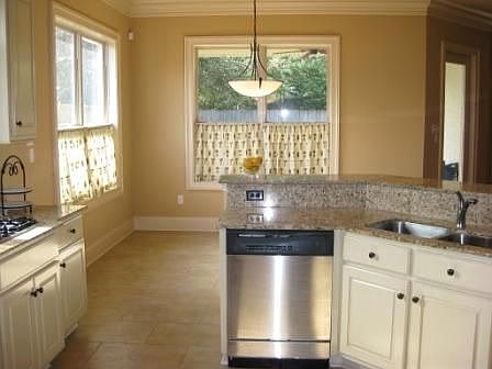 Slab granite counters in kitchen