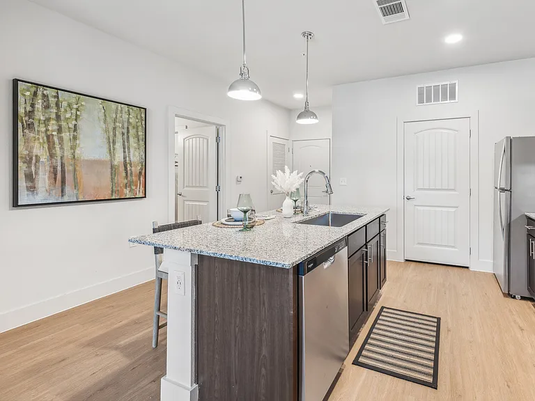 Your Kitchen: Granite countertops and pendant lighting