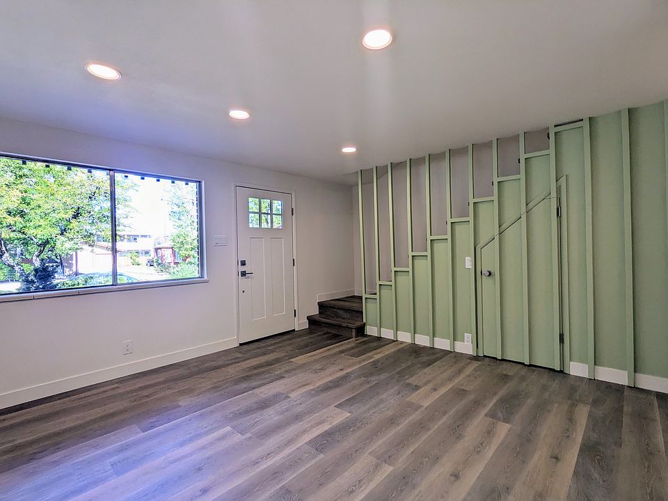Living Room with Extra Storage Under Vintage Stairs