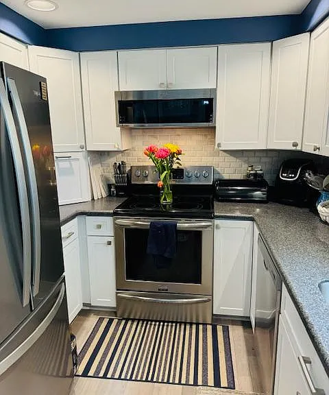 Kitchen with dishwasher and garbage disposal.