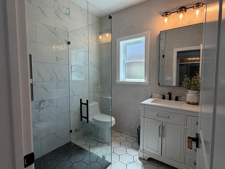 Hall bathroom adjacent to the 5th bedroom