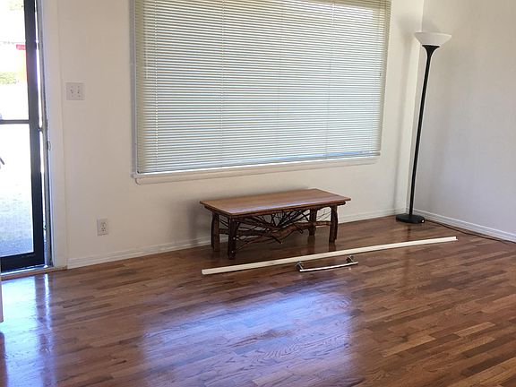 living room has big picture (operable) window. lots of light on gray days and great airflow with new windows that open