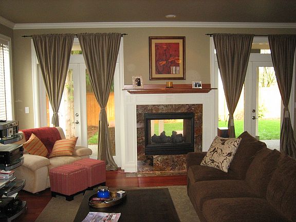 Family Room with fireplace and french doors to backyard covered deck