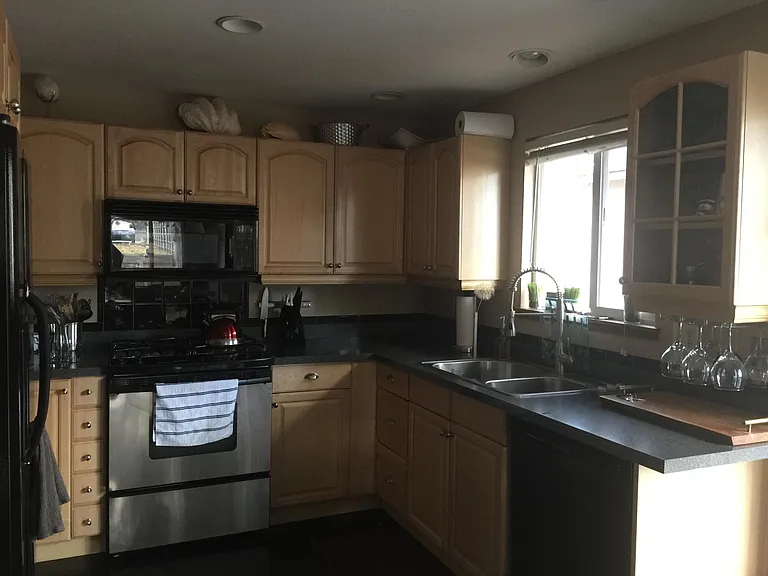 Kitchen is open to great room where dinning table separates