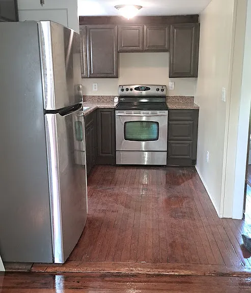 Galley style kitchen area, clean with a
new stove, refrigerator