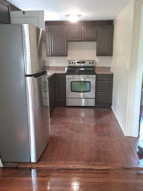 Galley style kitchen area, clean with a
new stove, refrigerator