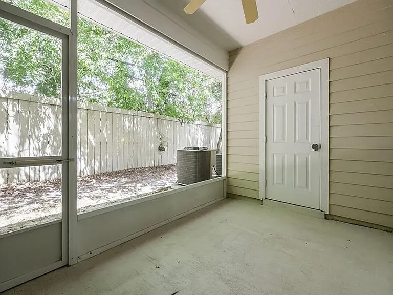 Covered and screened porch with extra storage