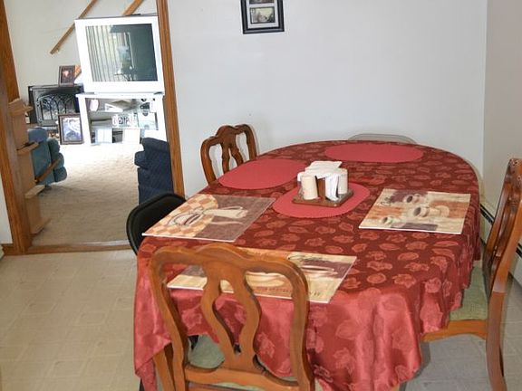 The dining area is connected to the kitchen. The kitchen appliances will be staying with the home.