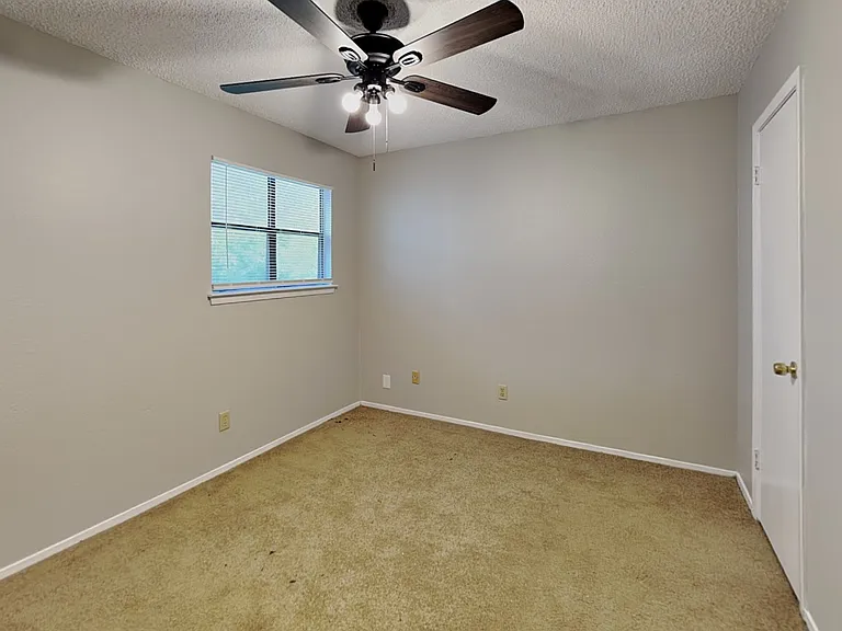 Spacious bedroom with neutral
