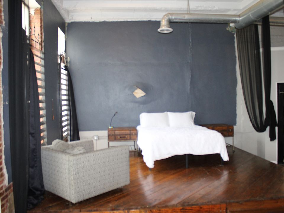 Elevated Bedroom overlooks Living Room & Kitchen. Very open feel with 15 feet tall ceilings.