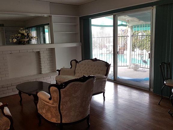Living room- look out to swimming pool.