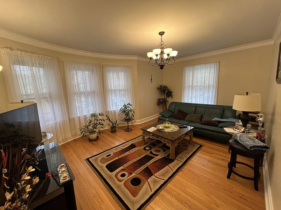 Large airy living room with windows bringing in tons of natural light.