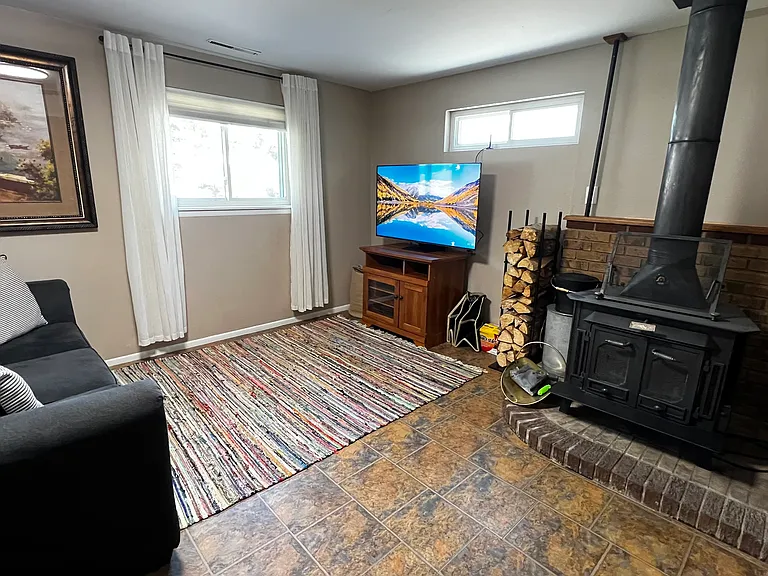 Second living room with a 55" smart TV, perfect for movie nights or giving everyone their own space to unwind.