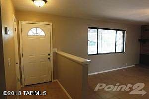 Foyer with main door and closet to left