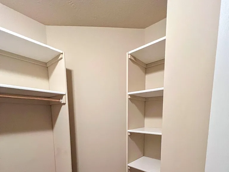 Primary Bedroom walk-in closet