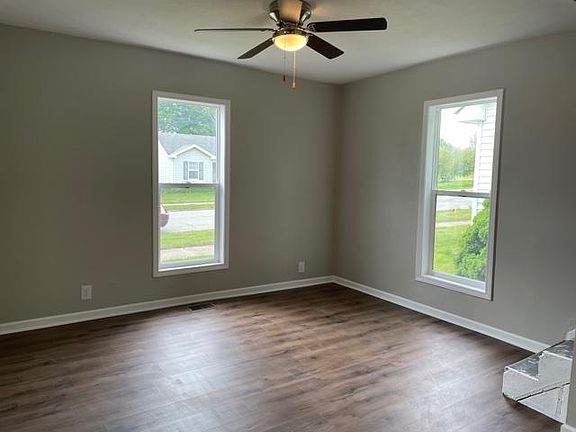 New windows on both floors. Living room with stairs to upstairs (closet not pictured)
