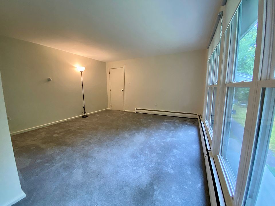 Another view of the living room. Door leads out to the common area hallway.