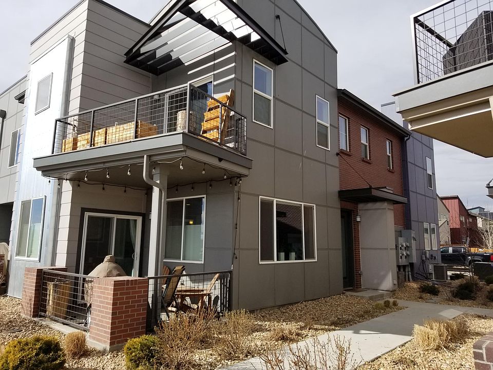 Front of home with private patio and balcony