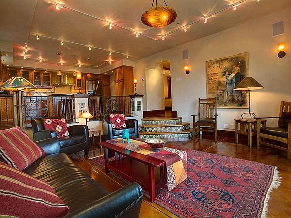 Living room. Note the tile work, extensive lighting and the warm, amber-colored floors.