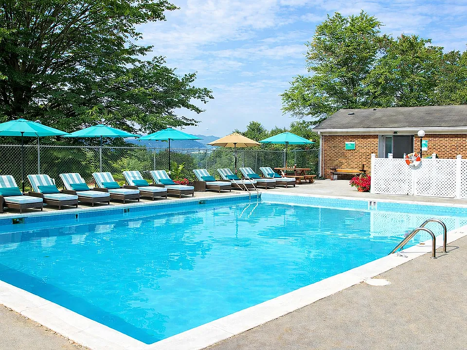 Sunny poolside retreat with umbrellas