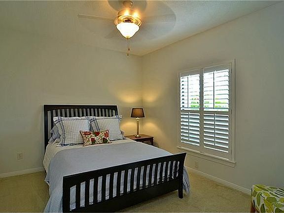 Secondary bedrooms have neutral paint and carpet.