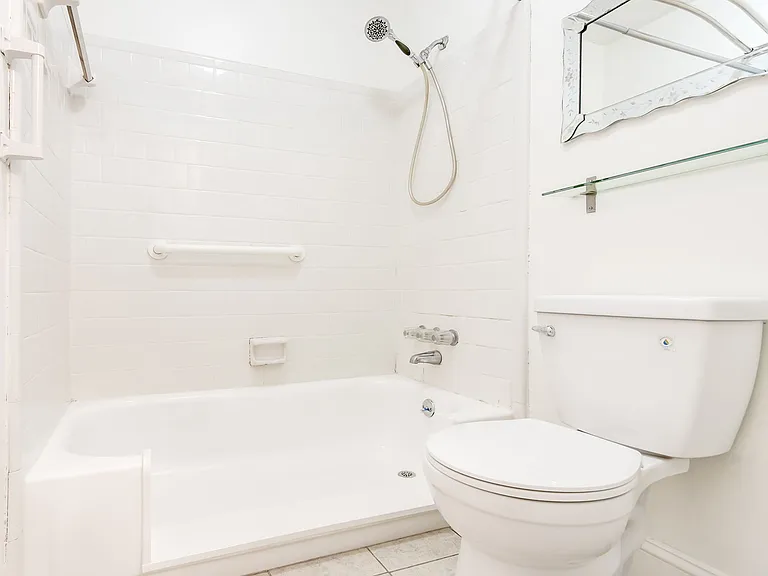 Bathtub converted to walk-in shower for accessibility