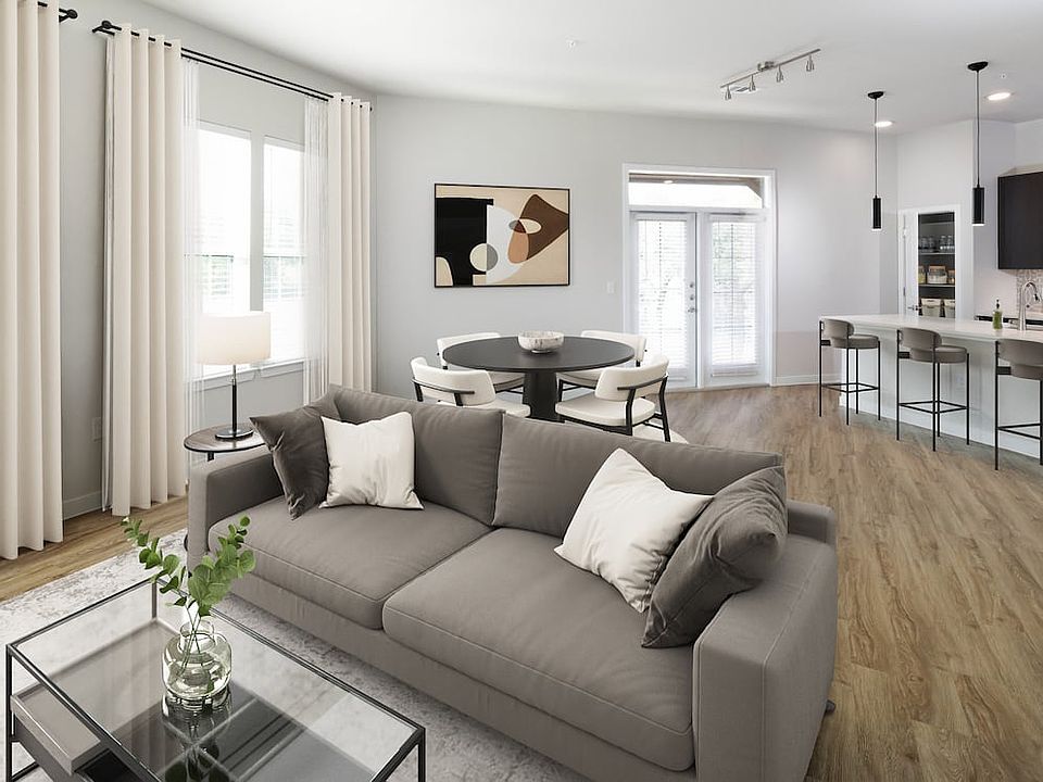 Dining and living room with hard surface flooring