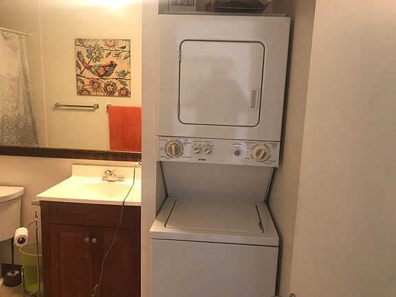 Bathroom with tub and laundry
