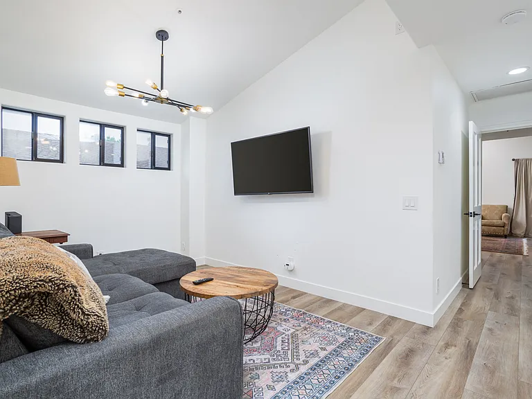 Loft with large tv and desk for flexible work space