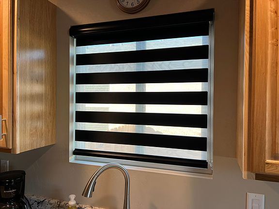 Zebra blinds can let in light and one way viewing or be room darkening.